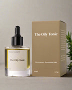 The Oily Tonic rosemary essential oil bottle and packaging on a white background